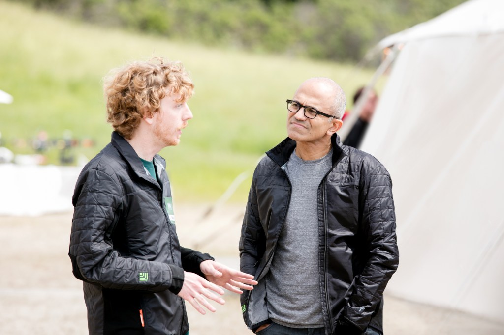 Close-up of two men talking